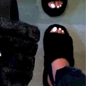 Black furry slippers